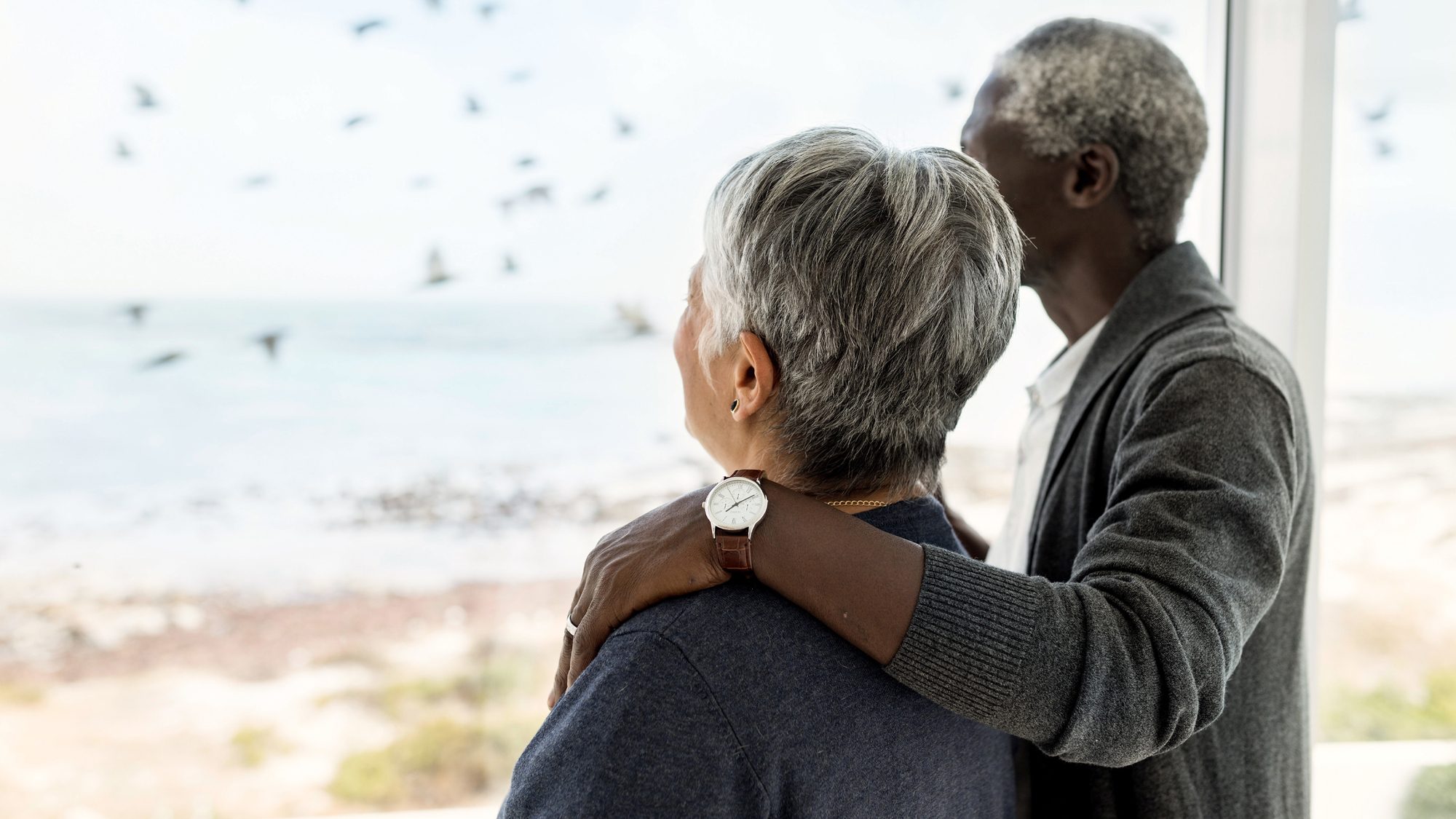 [Estate planning] Mature couple looking out window